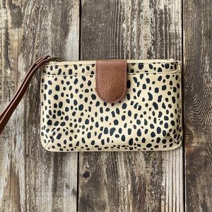 Small leopard print in beige colored coin pouch/ hand bag.